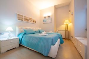A bed or beds in a room at Villa Lucia Laglio
