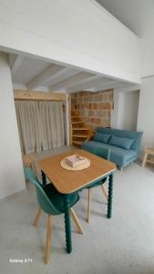 a living room with a table and a couch at MandorleOlio Versomare in Polignano a Mare
