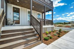 a home with a wooden staircase leading up to a house at Whitewater Estate House & Guesthouse w Hot Tub in Buena Vista +87 photos