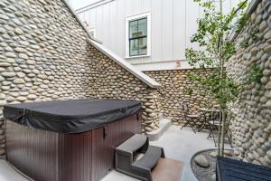 a patio with a bar and a table and chairs at Whitewater Villa - 5BR Luxury Retreat with Hot Tub in Buena Vista