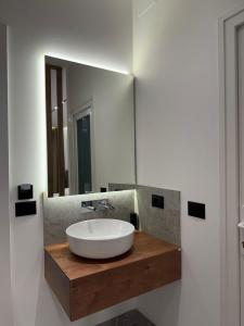 a bathroom with a white sink and a mirror at Hotel Jurgen in Lezhë +70 photos