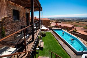 an external view of a swimming pool on a building at Casa da Cisterna in Castelo Rodrigo