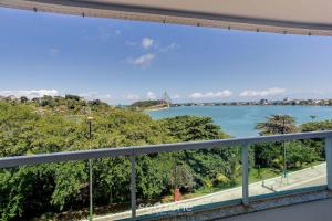 a view of the water from a balcony at Apto vista p/ rio c/ varanda - Pontal BCL402 in Ilhéus