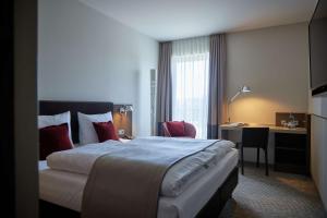 Voodi või voodid majutusasutuse bigBOX ALLGAEU Hotel toas