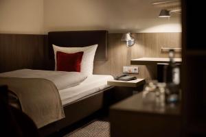 Voodi või voodid majutusasutuse bigBOX ALLGAEU Hotel toas