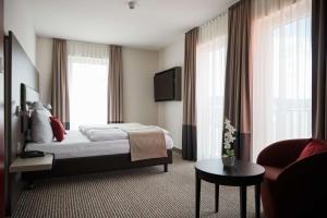 Voodi või voodid majutusasutuse bigBOX ALLGAEU Hotel toas