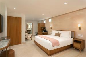 Ένα ή περισσότερα κρεβάτια σε δωμάτιο στο Alma San Juan