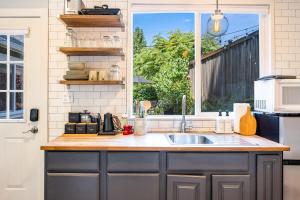 a kitchen with a sink and a window at Perch - Ballard Cozy in Seattle