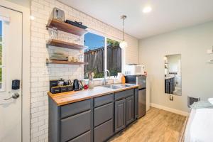 a kitchen with a sink and a counter top at Perch - Ballard Cozy in Seattle