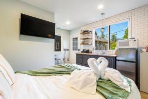 a kitchen with a large bed in a room at Perch - Ballard Cozy in Seattle