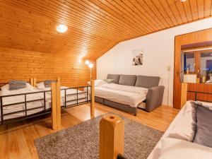a living room with two beds and a couch at Grieswirt L in Itter +42 photos