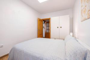 Łóżko lub łóżka w pokoju w obiekcie Amura Motril. Apartamento con garaje