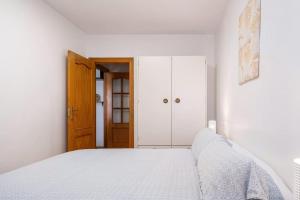 Łóżko lub łóżka w pokoju w obiekcie Amura Motril. Apartamento con garaje