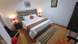 Postel nebo postele na pokoji v ubytování Mallku Wasi - Lodging Hotel Cusco