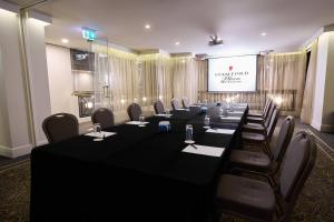 a conference room with a long table and chairs at Stamford Plaza Melbourne in Melbourne +37 photos