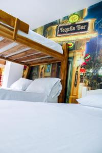 Postel nebo postele na pokoji v ubytování Hotel San Andres Arboletes