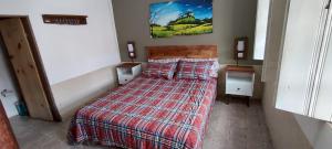 Cama ou camas em um quarto em Hostel Mucugê