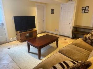 a living room with a couch and a coffee table at Luxury Apartment Living in Mississauga