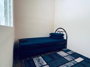 Postel nebo postele na pokoji v ubytování Inap Desa R'Sawit - Whole house