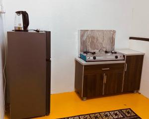 Kuchyň nebo kuchyňský kout v ubytování Inap Desa R'Sawit - Whole house