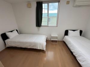 Ένα ή περισσότερα κρεβάτια σε δωμάτιο στο Nasu Townhouse N-6
