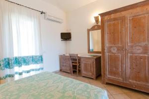 Postel nebo postele na pokoji v ubytování Hotel I Menhirs