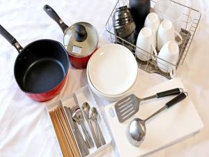 a bunch of utensils on a white counter top at Hotel Resort Inn Ishigakijima in Ishigaki Island