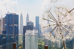 a view of a city skyline with a dandelion at NaiBnB in Agile Bukit Bintang - 5 mins walk to TRX in Kuala Lumpur