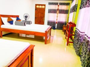 Voodi või voodid majutusasutuse Nine Arch Homestay toas