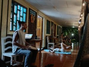 a group of people sitting on the floor in a room at Eco-Lodge El Porvenir. in Santa Cruz