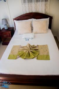 Postel nebo postele na pokoji v ubytování J&G Villa Hotel