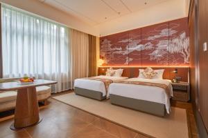 Voodi või voodid majutusasutuse Guangdong Hot Spring Hotel toas