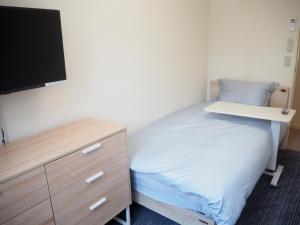 Postel nebo postele na pokoji v ubytování Midtown Inn
