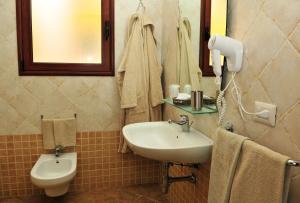 Koupelna v ubytování Hotel Castello Budoni