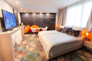 Postel nebo postele na pokoji v ubytování Science Hotel