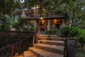 a house with stairs leading up to it at Buransh Terraces Luxury 3&4BHK Villas with Mountain View & Caretaker & Kitchen & Complementary Breakfast in Bhowāli