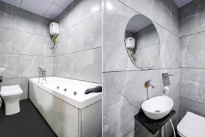 Ένα μπάνιο στο FabHotel Luxurious Inn - Near Prime Arcade