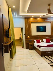 a hotel room with a bed and a bathroom at Fab Valley Homestay in Munnar