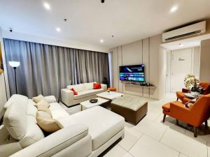 a living room with white furniture and a flat screen tv at ICity Luxury Corner 2room Hill10 Coway 1parking in Shah Alam