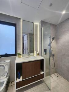 a bathroom with a sink and a shower and a toilet at ICity Luxury Corner 2room Hill10 Coway 1parking in Shah Alam
