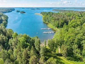 an aerial view of a river with a group of boats at 4 star holiday home in Edsbruk in Edsbruk