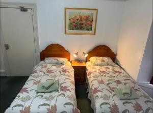Ένα ή περισσότερα κρεβάτια σε δωμάτιο στο The Bliss 3 Home stay, En-suite, Self check in with smart lock, Non Smoking Home in and out, Zero tolerance for noise after 11pm