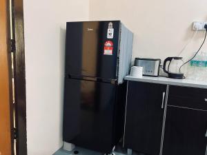 Kuchyň nebo kuchyňský kout v ubytování Inap Desa R'Sawit Pintu B