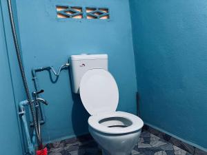 Koupelna v ubytování Inap Desa R'Sawit Pintu B