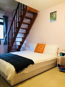 Postel nebo postele na pokoji v ubytování Yi Jia Homestay