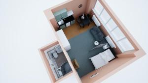 a rendering of a small apartment with a bedroom at HOSTEL PARK-Dobraszczecińska in Szczecińska