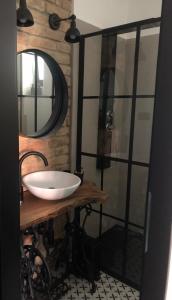 a bathroom with a white sink and a mirror at Bella Villa in Balatonalmádi +23 photos