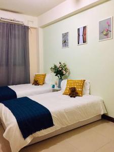 Postel nebo postele na pokoji v ubytování Yi Jia Homestay