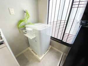 4F Guest House NETOMARI 西九条駅から徒歩2分にあるバスルーム