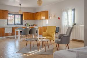 a kitchen with chairs and a table in a room at Grimihome 1 in Filiatra